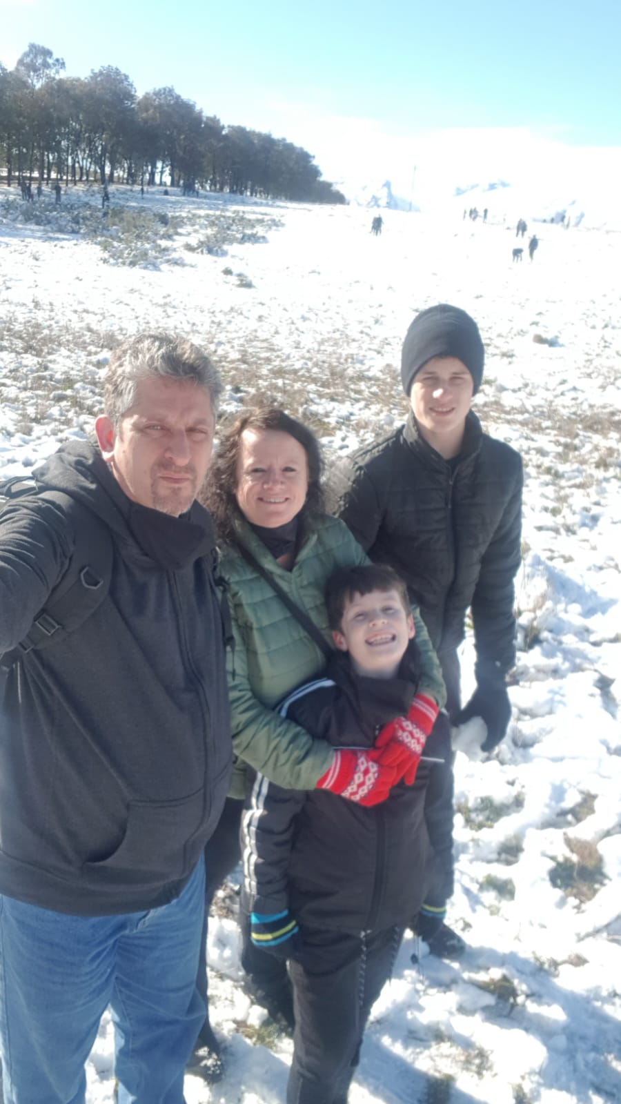 A family photo together in the snow